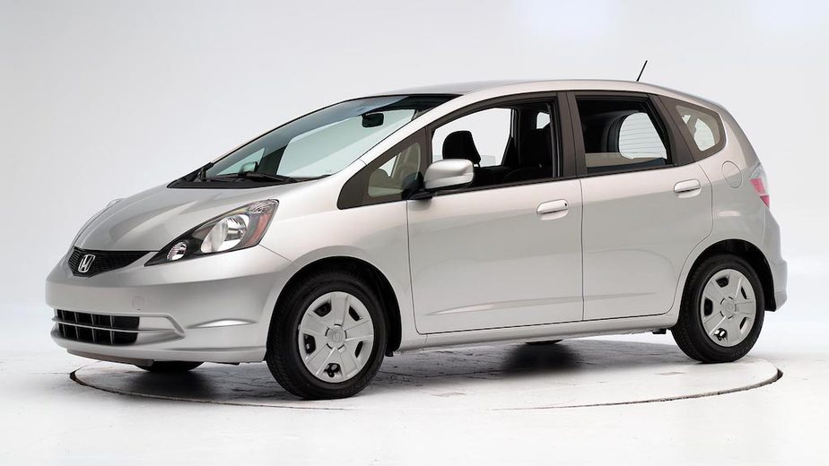 Best gas mileage used car that is cheap to buy, silver 2011 Honda Fit.